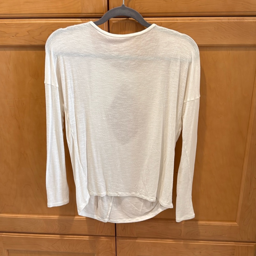 Open back long sleeve creamy white shirt.